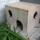 This homemade shelter for an indoor cage is a great comfort to the inhabitants.