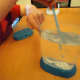 Mixing packet 1 in the aquarium.