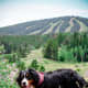 A Bernese Mountain Dog out for a hike.