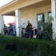 Band playing outdoors during car show at Towne Lake 