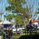 Many tents outside with people selling food, drinks, etc.