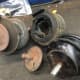 These are motor mounts that have failed. When a motor mount fails it can cause all kinds of knocking noises because nothing is holding the motor to the frame and the engine is flopping around in the engine bay. There's at least three more mounts.