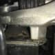 This is a motor mount that has collapsed internally. The mount holder (top) was hitting metal to metal every time the motor moved, making a loud knocking noise.