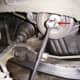 D. Crankshaft pulley removal. If using the ground to secure the bar, the bar should be at 5 o'clock, not 7 o'clock as shown here. The engine rotates clockwise.