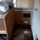 Flooring removed rear of camper. Bath is to the right. I am going to leave that floor alone as it seems pretty solid.