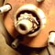 E. Remove cotter pin (A) and axle shaft nut cover (B)