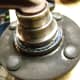 Y. Secure wheel hub to bench