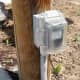 Surface mounted on a post bordering a driveway.  Not an RV outlet.