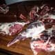 Slice bone-in steaks, thin or thick, as you think best. Your dog needs 10% total diet in bone.