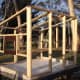 The frame of the hen house takes shape. We recycled one sheet of glass from an old oven door as a window. It is positioned at the height of the roosts, allowing us to check the chickens at night by shining a torch in.