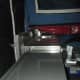 Optional kitchen sink and bench space that extends out from the rear of the trailer beneath part of the tent ... and folds into the trailer when you pack up to move.