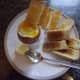 Boiled egg with toasted soldiers.