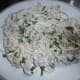 Spaghetti with cream cheese, greens and onion sauce.