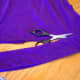 Cut a stretchy purple t-shirt to create a long strip of fabric to use as a belt.