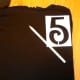 Use a stencil to create the 5 in the upper left corner of the shirt.