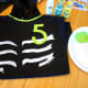 Use green and white paint to create the design.