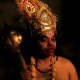 An actor dressed as Hanuman.