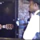 This photo is a reenactment of a young W.C. Handy (guitar in hand) demonstrating his new blues song entitled "Mr. Crump Blues" to a receptive auidence. (Reenactment)