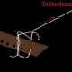 ...after it's twisted, thread the string through it and pull it up towards the headstock until the loop is snuggied down.