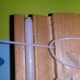 Wrap the short end of the string up and around the long end.