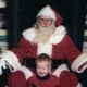 Who is unhappier -- Santa or this boy?