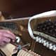 More stabilizing. See the three strings snuggled between the felt loops?