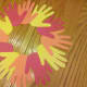 Use a glue stick or tape to connect hands together to make a wreath.
