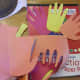 Trace and cut your child's hand out of red, yellow, and orange construction paper.