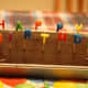 This simple chocolate-frosted cake uses fun candles for decoration.