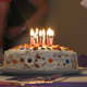 Nuts, candies, and vanilla frosting decorate this simple, fun cake.