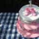 Pink and white cake for a 1-year-old.