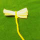 Tissue paper flowers made from facial tissue, showing the fold and the pipe cleaner stem.