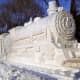 Harbin 2009 Ice &amp; Snow Festival: Snow Train with a Steam Engine on each side. The wagons are partly carved out for visitors to go inside.  This photo was taken by flickr user frankartculinary.