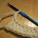 At end of the 1st row of double crochet, chain 3 before turning.