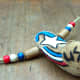 The pendant was painted red, white, and blue for an American spirit theme using acrylic paints.