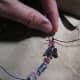 5. You can use a piece of wire or a toothpick to pull your final knot up close to the last bead. Be sure to double knot.