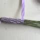 Continue weaving until the flowers are covered. Then wrap the ribbon around the stems.