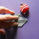 Use two fingertips as guides in creasing at the Xs vertically. You may use a flat ruler, instead.