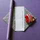 Turn each corner point in so they meet on center as shown. Use your pinch marks and ruled line as guide. The paper will have points on the left and right.