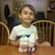 My son proudly displaying our sock snowmen!