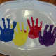 Here's the ceramic platter with all four handprint flowers.