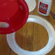 Use glue to attach bowl to ring of paper plate.