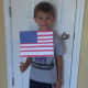 My son proudly holding his flag.