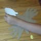 Cut out head shape from white construction paper and attach to top of footprint.