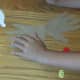 Attach handprints to back of footprint with glue stick.