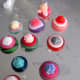 Button rings in progress on one of my gluing cookie sheets.