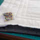 Pin the zip in the open side, making sure the tongue of the zip is on the right side of the design (the inside in this photo).