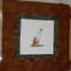 The finished patchwork frame around the cross stitch.