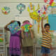 The kids showed off their kites prior to cutting them to shape.