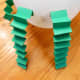 Bend pieces of construction paper back and forth to create arms and legs and tape to balloon.